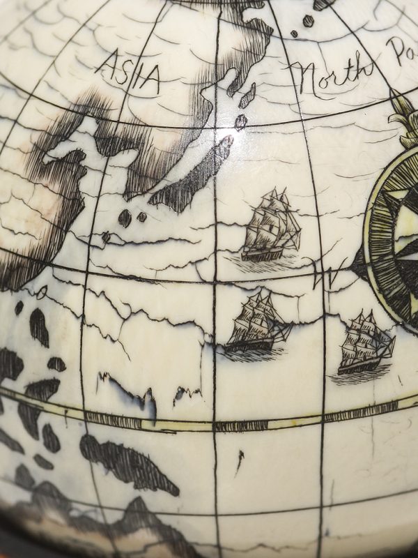 Scrimshaw Globe on Ivory Cue Ball