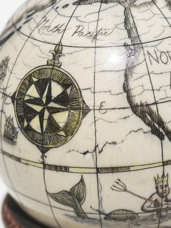 Scrimshaw Globe on Ivory Cue Ball