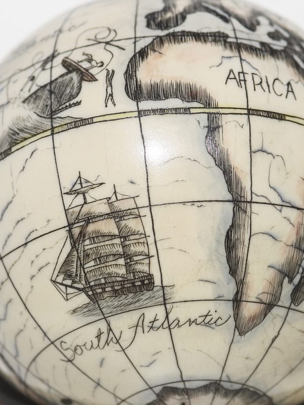 Scrimshaw Globe on Ivory Cue Ball