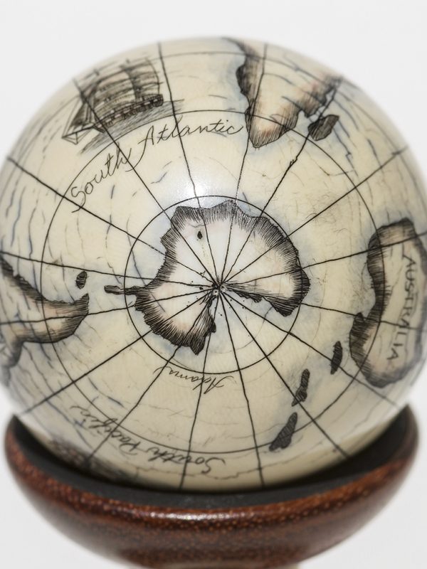 Scrimshaw Globe on Ivory Cue Ball