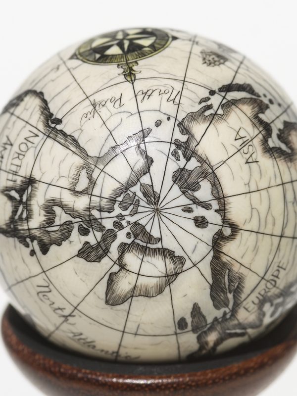 Scrimshaw Globe on Ivory Cue Ball