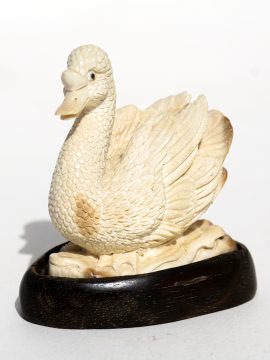 Unknown Carver - Graceful Swimming Swan