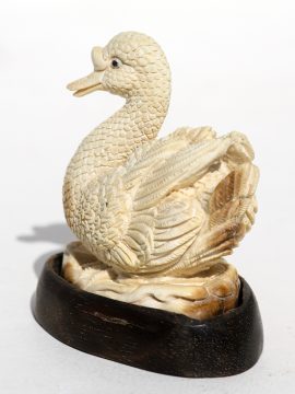 Unknown Carver - Graceful Swimming Swan